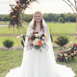 Bride holding an autumn bouquet